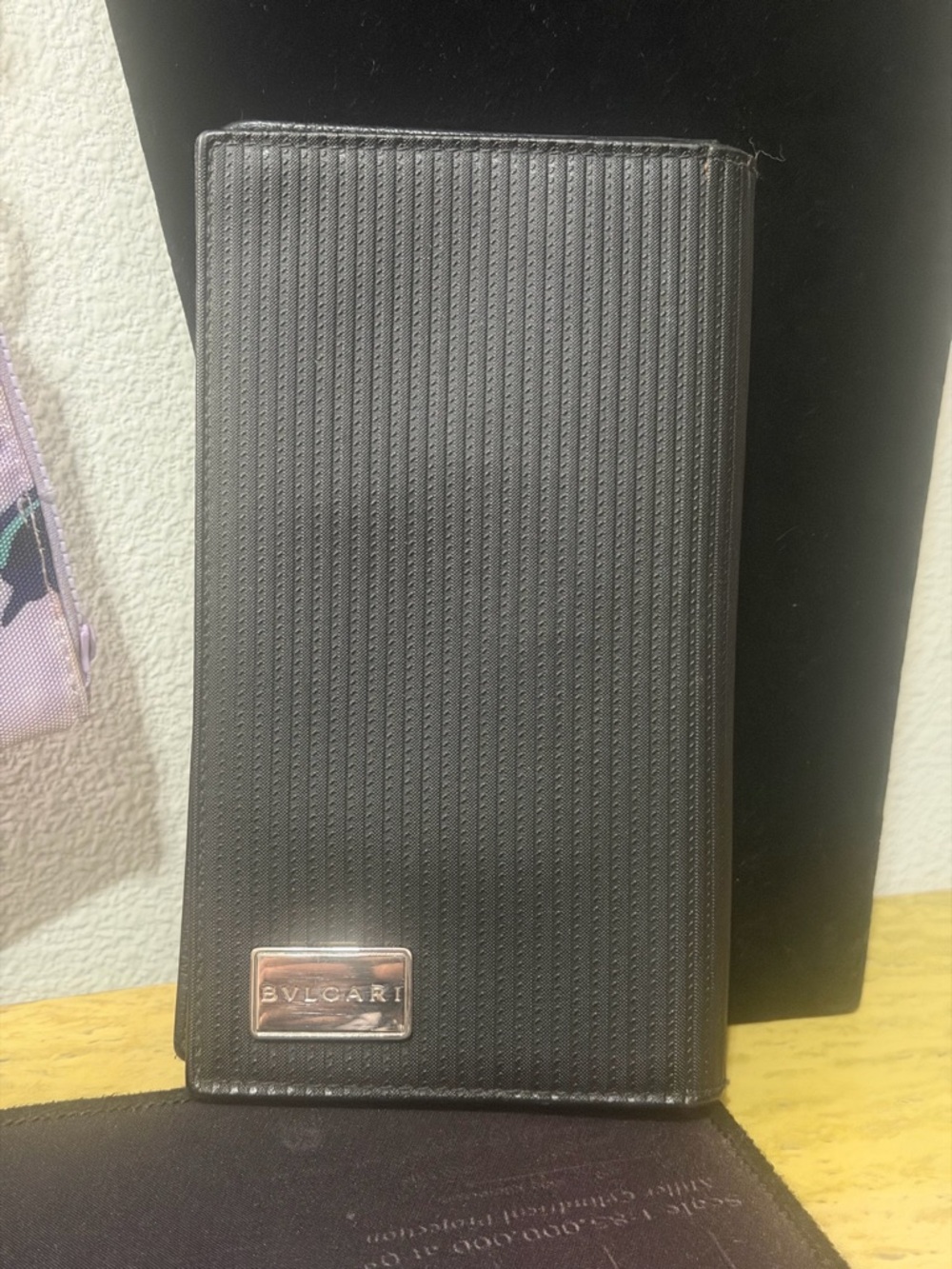 BVLGARI Mille Righe long wallet made from PVC and leather.